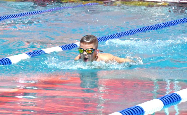 Hunter Nelson competes in the 25 fly event during the Webster High Point Swim Meet July 11. Nelson was able to get first in the event with a time of 31.22. Reporter &amp; Farmer | Connor Handrahan