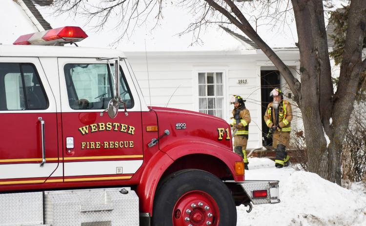 Webster Fire Department responded to a small house fire at 1015 Main St. Dec. 6. The fire was caused by an electrical heater in the home. No injuries or serious damage resulted. Here, firefighters Allan Jaspers and Wes Hoven walk out of the home after evaluating the scene. Reporter &amp; Farmer | Brenner Cariveau