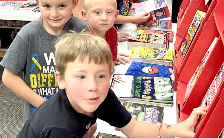 Front to back, Rogan Rithmiller, Brody Shafer, Landon Kvernevig, Cruz Shafer and Eli Ploof enjoyed looking through the selections at Webster Area School’s bookfair Oct. 7-10. Reporter &amp; Farmer | Subscriber snapshot