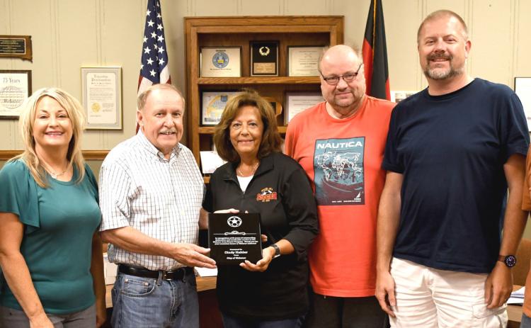 Cindy Hahler was presented an award during Webster City Council’s Aug. 10 regular meeting for her 31 years of dedication to the Webster youth soccer program. Pictured from left are council members Wayne Klungseth, Stacy Mount, Mayor Mike Grosek, Hahler, council members Brian Vogl, Derek Sinner and Toni Brown. Reporter &amp; Farmer | Amanda Dulitz