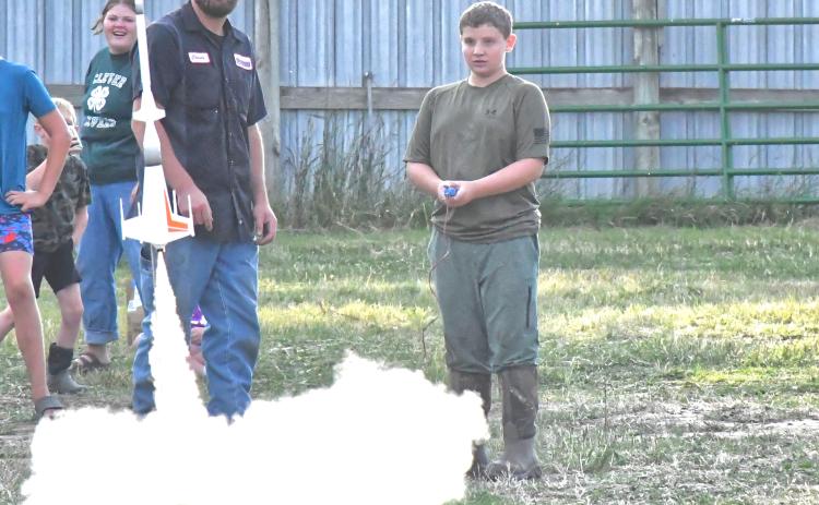 Day County Fair started Aug. 5 and continued throughout the weekend until Aug 9. To kick off the fair, Day County youth launched their rockets and spent the evening watching their creations reach the skies. From left, Kelsey Fischer watches Connor Fischer help Abel Bloom launch one of their bigger rockets. Reporter &amp; Farmer | Connor Handrahan