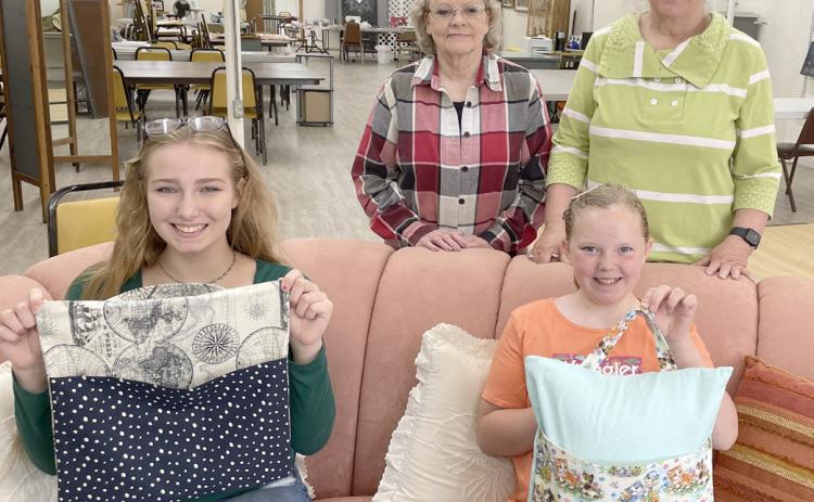 Day County Arts Council, wGlacial Lakes Piece Makers and Day County 4-H sewing workshop was June 22 at Day County Arts Center, Webster. An on-the-go travel pillow was constructed with guidance from instructors, standing, Sandy McCarlson, left and Denece Draper; seated, participants Delilah Buxton, left and Christine Hughes. Reporter &amp; Farmer | Subscriber snapshot