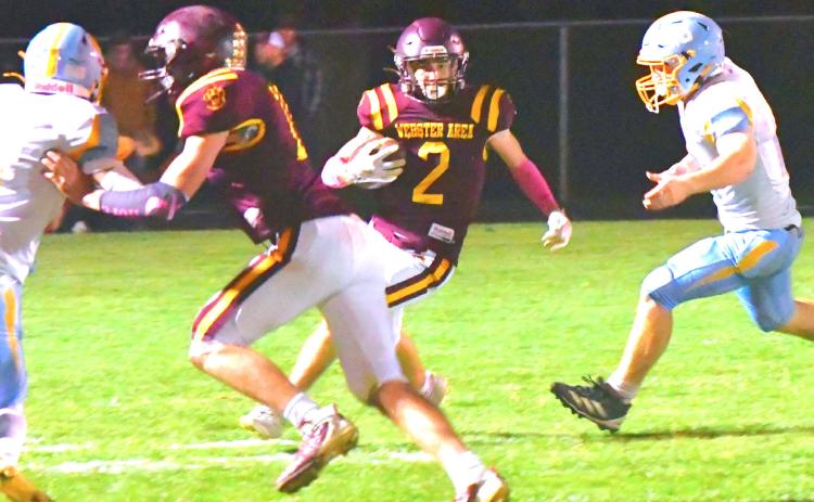 Webster Area Bearcats football took a hard loss against Hamlin Chargers during their home game Oct. 2. Bearcats tried their best to fight back, but Hamlin forced a 50 point mercy rule during the third quarter. Here, Gabriel Gaikowski runs for a first down with Aiden Gaikowski clearing a path for him. Reporter &amp; Farmer | Connor Handrahan
