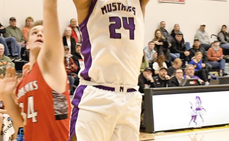 Waubay/Summit Mustangs Traveion Neilan goes up for a basket Feb. 11 in Summit when they played host to the Estelline/Hendricks Redhawks. Mustangs were left picking feathers out of their manes when the Redhawks flew away with the victory on the night, going 11-18, 20-25, 28-57 and 42-71. Reporter &amp; Farmer | Robert Dulitz