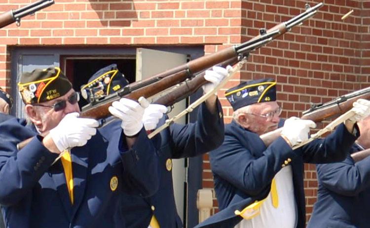 Shots were fired in a 21-gun salute to fallen veterans during the Webster Memorial Day program at the Webster Armory May 27. Members of the VFW and American Legion Honor Guard shown here are Tom Lewno, Doug Lynch and Ed Damrau. Reporter &amp; Farmer | Amanda Dulitz
