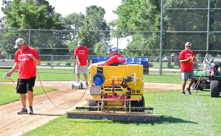 With 22 games being played within six days, the Webster baseball complex needs to be properly maintained, that’s where the grounds crew comes. in. From left, Wade Rausch, Devin Pederson, Kevin Schimmel and Brian Lux can be seen applying fresh chalk for the third baseline. Reporter &amp; Farmer | Connor Handrahan