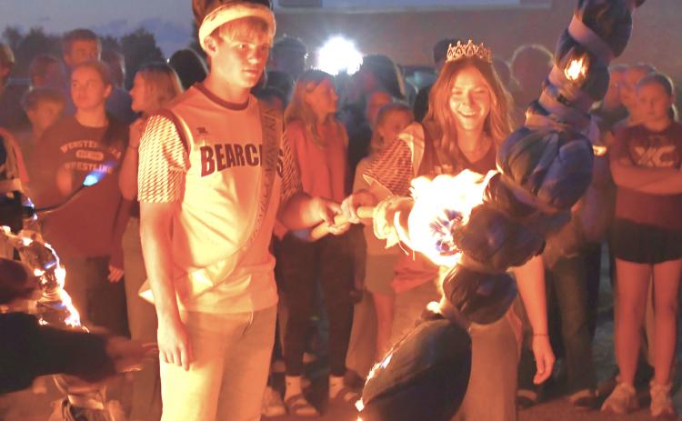 Webster Area School District held their burning of the W celebration during the coronation Sept. 14. Homecoming king, Gage Baumgarn and queen, Chloe Mammenga light the torch to start off the week of celebration. Reporter &amp; Farmer | Connor Handrahan