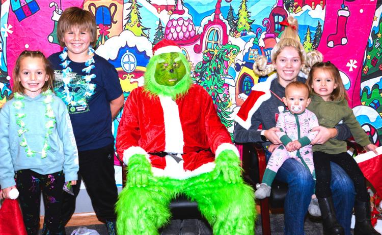 The Grinch and Cindy Lou Who met with families at Waubay Senior Center’s Christmas celebration Dec. 6. Violet, Braxton, Brynleigh and Lesedi Renville talked and joked with The Grinch and Cindy Lou Who. Jokingly, everyone kept their distance from The Grinch, just in case he tried something. Reporter &amp; Farmer | Connor Handrahan