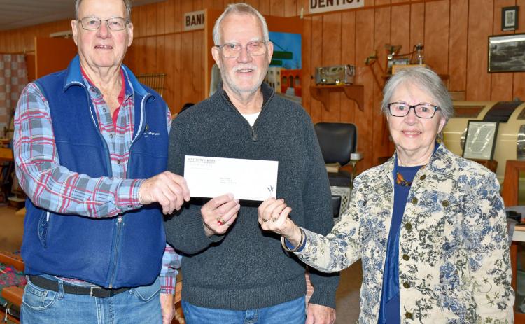 Holding up a check for $60,000 donated to the Museum of Wildlife, Science &amp; Industry in Webster by Harry and Denise Knapp, are from left H. Knapp, museum board president Monte Rougemont, and D. Knapp. Donations now total $140,000 which the museum has received to construct a new building to house the contents being relocated from the Day County Courthouse Museum. Reporter &amp; Farmer | Leyton Beardslee