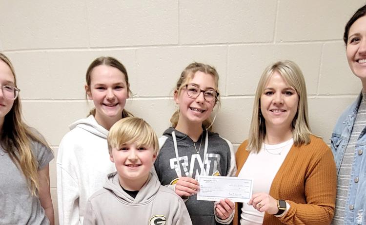 Webster Area Student Council members, front Barrett Bloom, fourth grade; back, from left, eighth graders Claire Halvorson, Sophia Wilson and Remi Hubsch presented a $1,000 check to playground committee members Vanessa Bloom, fifth grade teacher and Emily Wagner, second grade teacher. Funds were raised through last fall’s Driven Coffee fundraiser and will support the new playground and gym floor project. Reporter &amp; Farmer | Subscriber snapshot