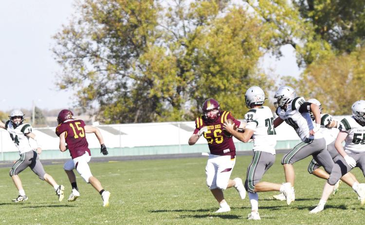 Webster Area Bearcat defensive lineman John Sonstebo (56) chases after Clark/Willow Lake quarterback Emmerson Larson (22) after he rolled left with a trio of blockers trailing him during the last home game of the season Oct. 19. Clark/Willow Lake reciever Griffin Musser (24) signals he’s open with Bearcat defender Gage Baumgarn (15) trailing behind him. The Bearcats ultimately closed out their season in a 6-18 loss against the Cyclones. Reporter &amp; Farmer | Brenner Cariveau