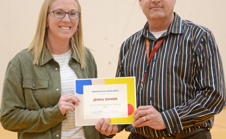 Jenna Sinner was announced last week as the Region 1 Teacher of the Year during an assembly at Webster Area High School April 23. Sinner was presented a certificate by Webster Area Superintendent Jim Block who explained he had just received notification that morning of Sinner’s award from the state. Reporter &amp; Farmer | Amanda Dulitz