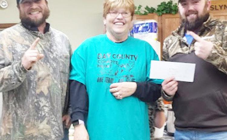 In Roslyn the 18th annual coyote hunt organized by Patti Mitchell took place Dec. 13-15. During the competiton, 74 total coyotes were harvested. Here from left, Adam Imberi from Clark stands next to Mitchell and his teammate Dominic Plunkott from Watertown as they are handed their check worth $1,500. As a team Imberi and Plunkott harvested 21 coyotes. Reporter &amp; Farmer | Subscriber Snapshot
