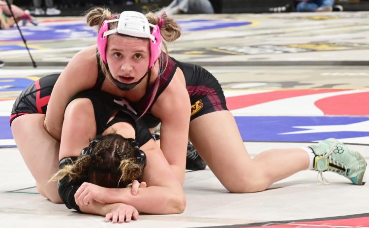 Bearcat girls wrestlers competed in the state wrestling tournament Feb. 27- March 1 in Rapid City. Here, Brooke Grajczyk mantles her opponent during the match. Grajczyk finished sixth overall in the girls 145 weight class. Reporter &amp; Farmer | Dax Jorgenson