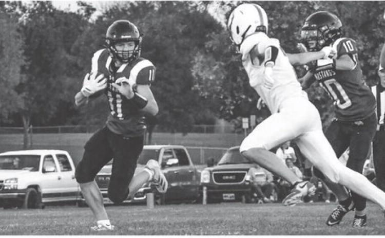 Krew Gaikowski (11) returns a kickoff for Waubay/Summit during their 0-53 loss against Britton-Hecia in Waubay Oct. 3. No statistics were reported for the game but the Mustangs move to a record of 1-6 on the season. Reporter &amp; Farmer | Leyton Beardslee
