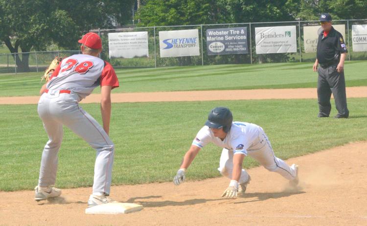 Webster Post 40 competed in the Legion Region tournament July 21-22. This was Post 40’s first game of the tournament and they played against Britton Lumberjacks. Here, Chase Gregerson can be seen sliding into first after almost getting picked off at first. Reporter &amp; Farmer | Connor Handrahan