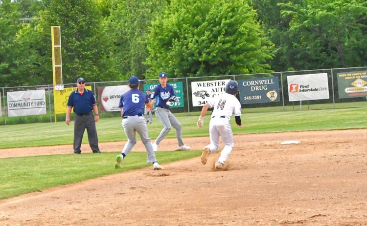 Post 40 second baseman Jack Shoemaker throws the ball to shortstop Sheldon Schmieg to set up a double play at second and first during the Post 40 vs. Rattlers game June 20 during the Ashley Charron Wood Bat Tournament. Reporter &amp; Farmer | Connor Handrahan