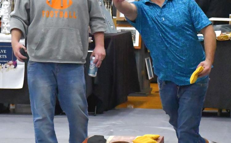 The annual German Fest was held Sept. 26 and attending community members enjoyed a day full of fun with vendors, German food and drinks, games and a corn hole tourney. Chris Spiering, left, and AJ Meland continue to play bean bags after the tournament finishes. Reporter &amp; Farmer | Connor Handrahan