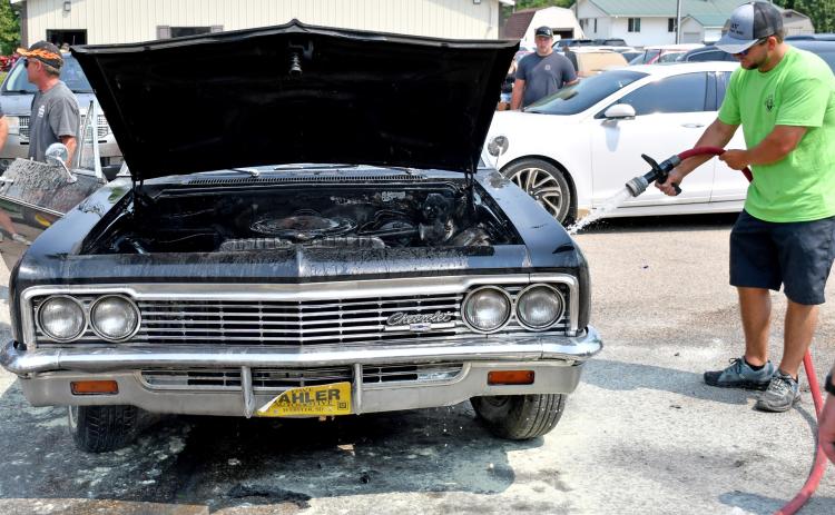 Classic car catches fire after parade