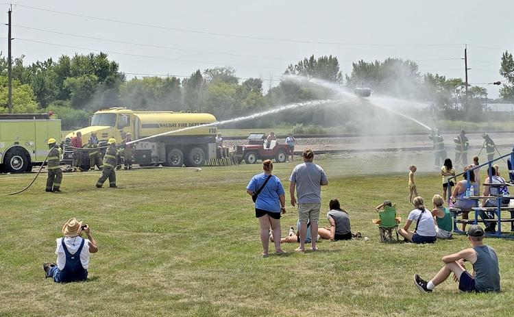 Summit Fire Department was the winner of the annual Fireman’s Water Fight in Waubay last weekend during the Waubay Fun Fest activities. Pictured, a crowd watches as a Summit team goes up against a team from the Waubay Fire Department. Reporter &amp; Farmer | Subscriber snapshot