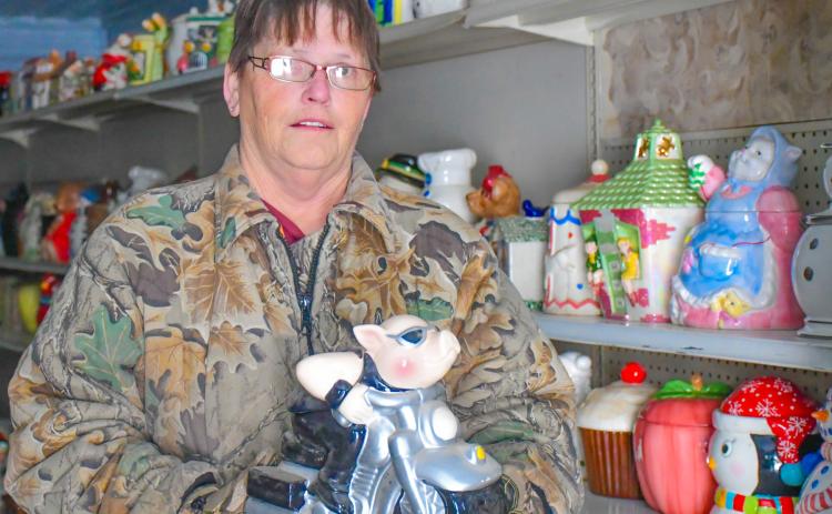 Patti Mitchell holds one of her approximately 6,000 cookie jars in her future museum in Roslyn Dec. 6. Mitchell said she has been collecting for 30 years is hopeful the museum will open to the public in May 2026. Reporter &amp; Farmer | Leyton Beardslee