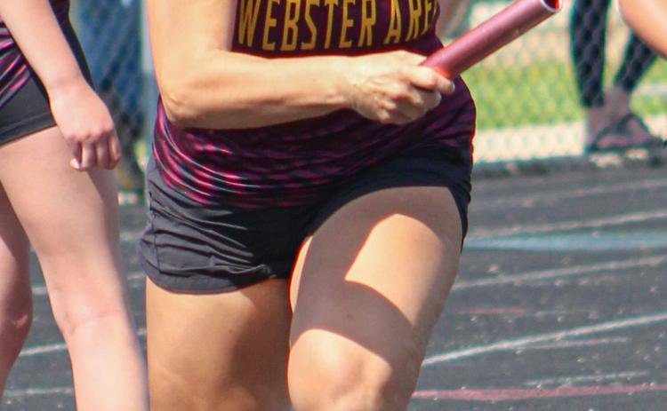 Gracie Cadwell bursts forward at the start of a relay race during the Webster Invitational track meet May 16 held in Webster. Reporter &amp; Farmer | Subscriber snapshot