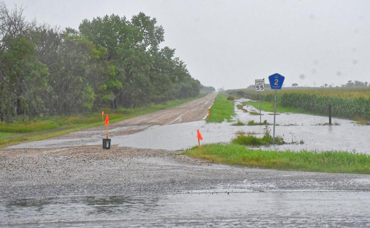 Day County was hit with flash flooding July 30. Many roads and fields along South Dakota Hwy. 27 were under several inches of water and were completely undriveable. Here, part of SD Hwy. 27 and 126th St. is under water and water from an adjacent field overflows onto the highway and street. Reporter &amp; Farmer | Connor Handrahan