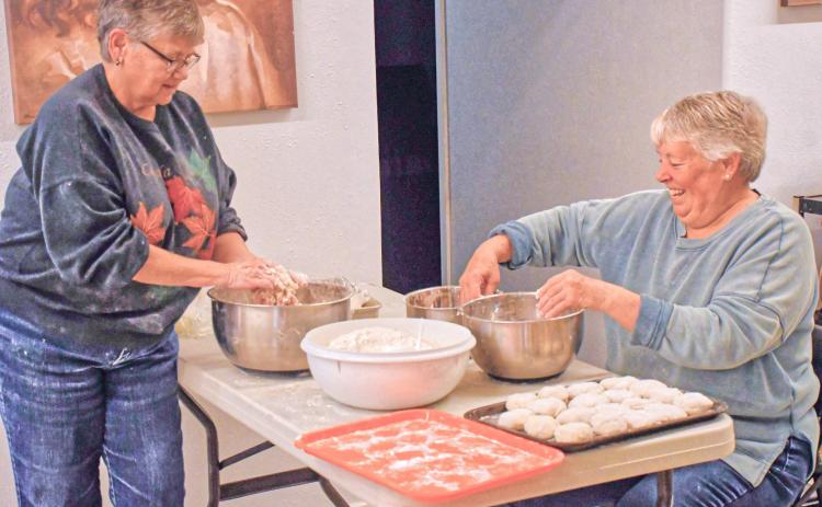 Lori Keller, left, and Sue Walter, right, help make lefse at Tabor Church, Webster lefse fundraiser Nov. 21. Keller and Walter were in charge of mixing together flour, sugar, potatoes and cream to get delicious tasting lefse. Reporter &amp; Farmer | Connor Handrahan