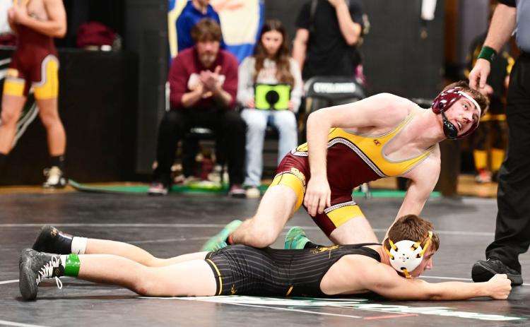 Webster Area Bearcats wrestling season started Dec. 7 with the CWL Booster Club wrestling tournament at Clark High School. Here, Webster Area wrestler Trace Shoemaker lays his knee on the back of his opponent. Reporter &amp; Farmer | Subscriber Snapshot