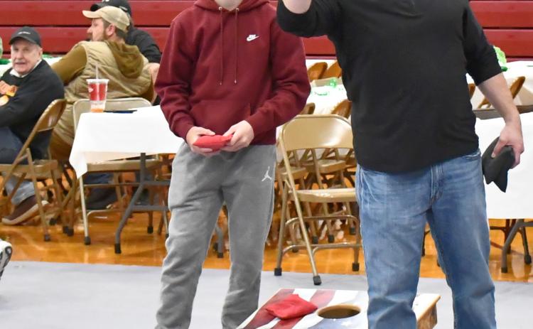 The annual Shake your Shamrock event in Webster was held on the rescheduled date April 25. Here, Maverick Coester and Morgan Dorsett battle back and forth for the first points of the finals in a cornhole tournament at the event. Dorsett and his partner Martin Dorsett ended up taking first place at the event. Other activities were held throughout the day. Reporter &amp; Farmer | Connor Handrahan