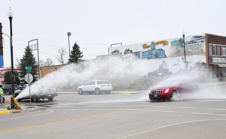 The fire hydrant on the corner of Main St. and W. 6th Ave., Webster was being flushed Nov. 6 while a car passes through the gushing water. Reporter &amp; Farmer | Brenner Cariveau