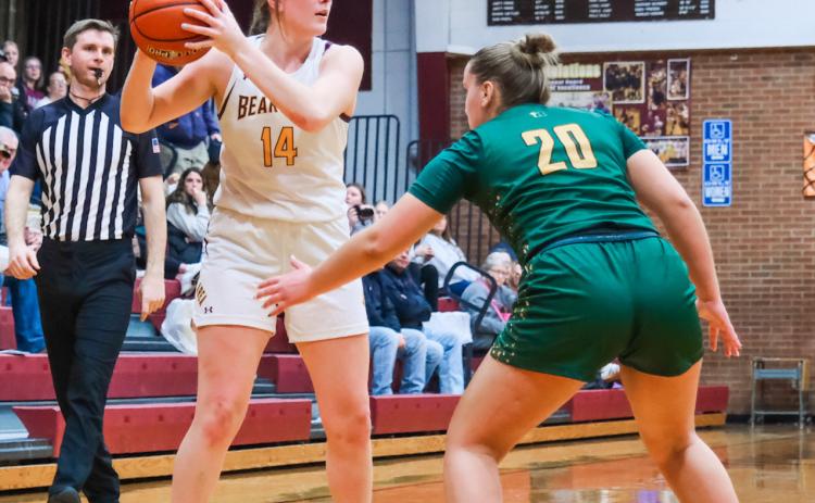 Mallory Steiner (14) of Webster Area looks to pass during the Bearcat’s girls varsity basketball game against Aberdeen Roncalli Dec. 29 in Webster. Bearcats couldn’t keep up with the Cavaliers and fell 36-50. Reporter &amp; Farmer | Leyton Beardslee