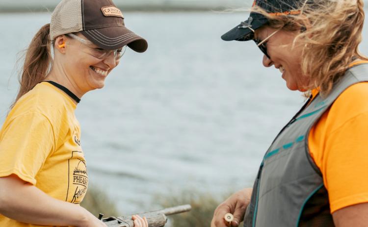 New hunter Lyndsay Krueger, Mason City, IA takes instruction from Sandy Austin at the women’s pheasant hunting workshop. Reporter &amp; Farmer | photo by Nina Hoekstra @in.ninas.nature