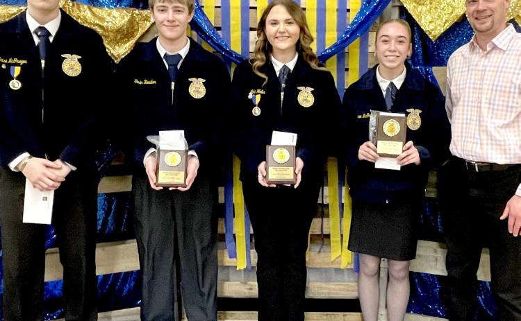 Best record book awards, sponsored by Dacotah Bank, were presented at the Webster/ Waubay FFA banquet by bank president Kelly Hanson, right. Award recipients for each grade, from left, are senior Blaise McGregor, junior Tevin Howder, sophomore Lola Wells and freshman Macee McGregor. Reporter &amp; Farmer | Subscriber snapshot