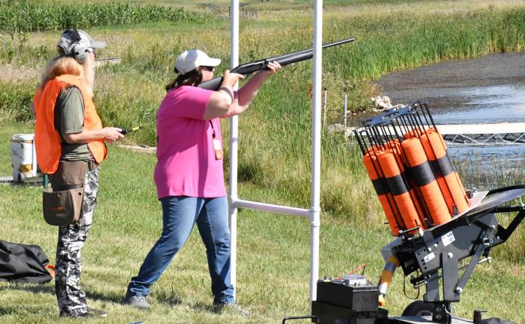 Tina Dokken, left, coaches Michele Markie in clay bird shooting Aug. 22 at the fourth annual Women on the Wing event, when 30 women came together to learn the techniques of hunting and shooting. Reporter &amp; Farmer | Timothy Gibson