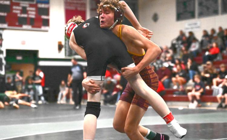 Tayten Kurkowski lifts up his opponent during a match at the Northeast Conference Tournament Dec. 19 in Clark. Kurkowski placed second in the 126 weight class with a record of 1-1. Reporter &amp; Farmer | Brianna Jorgenson, Captured Creations Photography