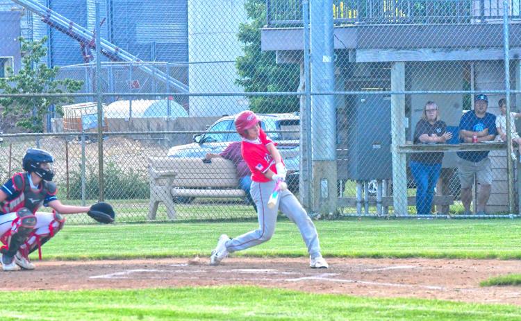 Bennett Kuecker hits a single during Webster Teeners’ first game against Lake Norden June 5. Kuecker was one of 11 runs to be scored in the first inning, which eventually led to a 16-6 victory. Reporter &amp; Farmer | Connor Handrahan