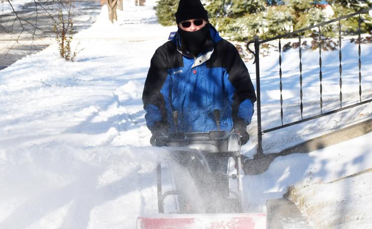 Day County received the first snow fall of winter late Nov. 19 with blistering winds and gusts of snow. Here, Sam Janssen uses a snow blower to clear his sidewalk of the fresh snow on E. 9th Ave., Webster Nov. 21. Reporter &amp; Farmer | Brenner Cariveau