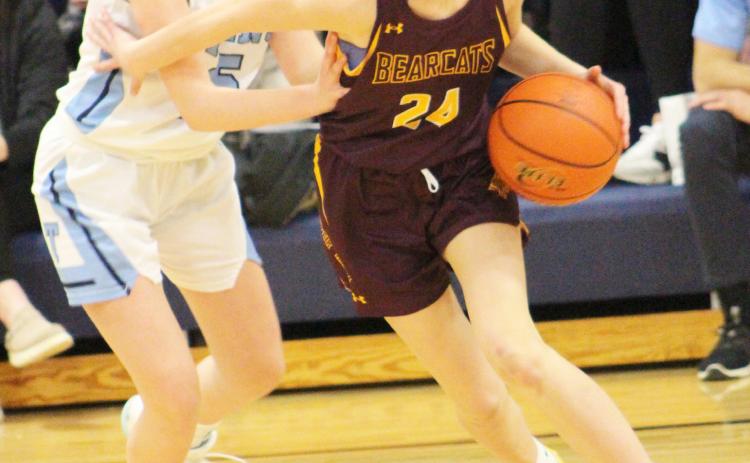 Webster Area Bearcats girls basketball squared off against Leola/Frederick Area Titans on the road Feb. 15. Bearcats prevailed in the contest with a final score of 5625. Here, Cartney Hanson (24) escapes pressure from Titans defender Eden Podoll (15). Reporter &amp; Farmer | Subscriber Snapshot