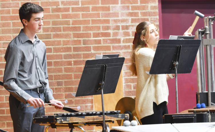 Webster Area High School and Middle School band performed Dec. 5 at the Webster Armory for the annual winter concert. Here, from left seventh and eighth grade band members Ace Lesnar and Remi Hubsch play their instruments in front of a large crowd. Reporter &amp; Farmer | Brenner Cariveau