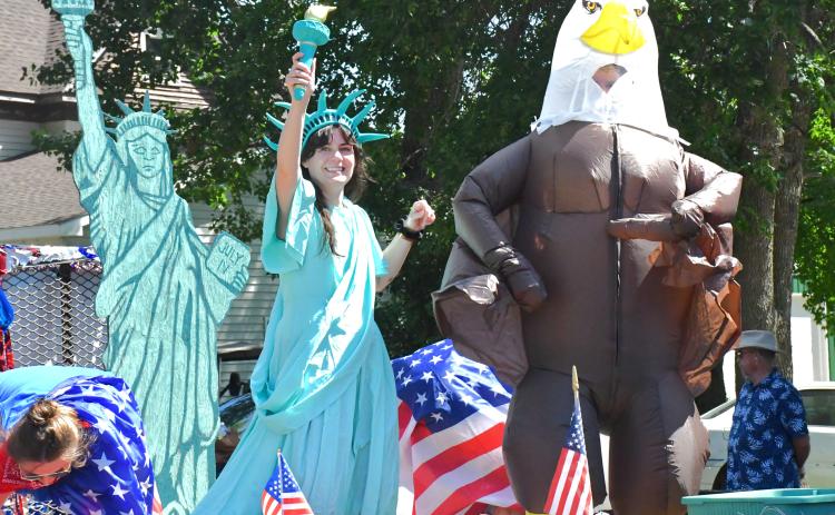 The annual parade at Waubay Fun Fest was another huge celebration for the community. Dozens of floats were driven down Main Street and candy filled the streets. Here, Brittany Hanna dressed up as the Statue of Liberty and Ryan Hanna showed off his American spirit by dressing up as an eagle. Pictures by Reporter &amp; Farmer |Connor Handrahan