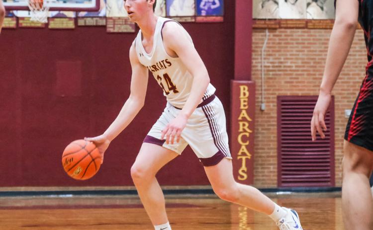 Gage Wik (24) of Webster Area looks for an opening during the Bearcats 59-48 victory against Sisseton Redmen Feb. 9 in Webster. Bearcats move to a record of 9-7 on the season. Reporter &amp; Farmer | Leyton Beardslee