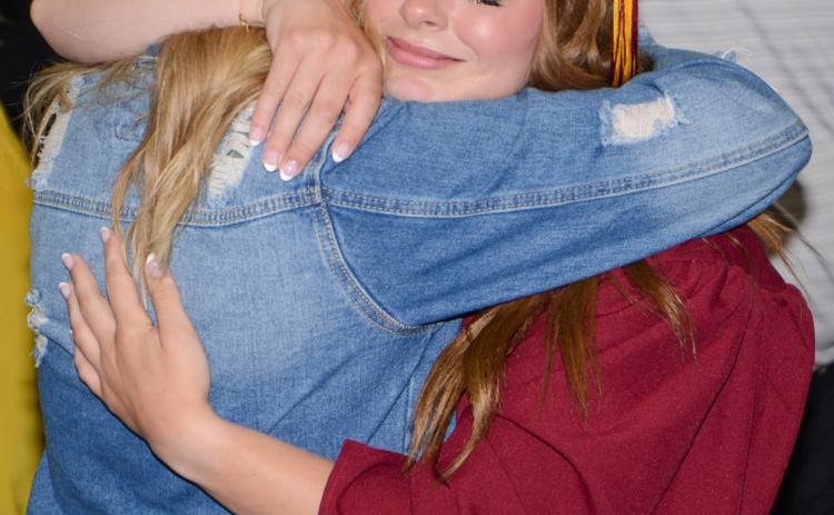 Webster Area High School graduate Charlotte Grewe shares an emotional moment with her mom Melissa Grewe May 19 during graduation proceedings at the Webster Armory where 32 graduates crossed the stage to receive their diplomas. Reporter &amp; Farmer | Amanda Dulitz