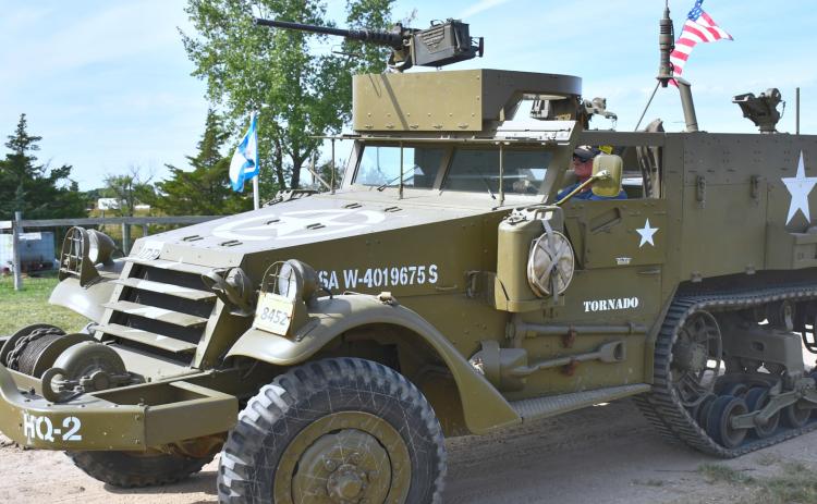 United States Marine Corps veteran Jimmie R. Nelson drives his 1943 M3 Half-Track Personnel Carrier as part of a special military equipment display to honor veterans in the Andover threshing show in Andover Sept. 12. Reporter &amp; Farmer | Timothy Gibson