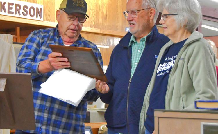 At the grand opening of the Museum of Wildlife, Science &amp; Industry June 13, Jim Brakefield announced the new library named after Monte and Fran Rougemont. From left, Brakefield can be seen surprising Rougemonts with the announcement of the new expansion. Reporter &amp; Farmer | Connor Handrahan