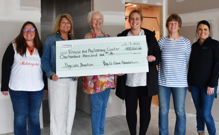 Day County Community Foundation members Amanda Dohn, Kim Sinner and Rita Johnson last week presented a $100,000 check donation to the Knapp &amp; Play Learning Center group, represented here by Jenna Wik, Kathy Meland and Rainy Hanson. Reporter &amp; Farmer | Annie Witt