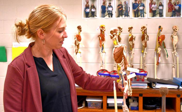 Webster Area High School science teacher Jenna Sinner shows off one of her student’s projects April 28. She has been named the Region 1 Teacher of the Year. Reporter &amp; Farmer | Leyton Beardslee