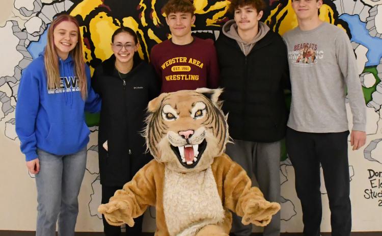 Webster Area wrestling program is sending five wrestlers to compete in the state tournament Feb. 27-March 1 in Rapid City. Here from left, Brooke Grajczyk, Jocelyn Rumpca, Tayten Kurkowski, Haeden Jorgenson and Gage Baumgarn stand behind the Bearcats’ mascot. Reporter &amp; Farmer | Brenner Cariveau
