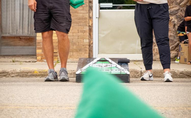 Corn hole players Paul Mogen of Casper, WY and Jocelyn Halma of Slayton, MN watch Mogen’s shot fall on the board during Waubay Fun Fest July 19. After a hard fought game Halma, who said she used to live in Waubay, emerged victorious. Reporter & Farmer | Leyton Beardslee