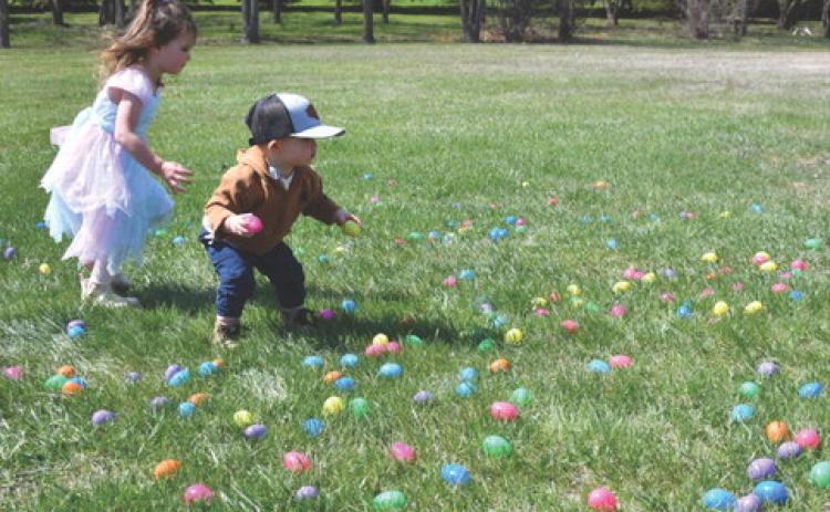 Chesney and Stone, son and daughter of Dani and James Pearson dash through a colorful spread of Easter eggs during the Easter Eggstravaganza hosted by First Baptist Church May 2. The event was postponed earlier in the year due to weather. Reporter &amp; Farmer | Jessica Washenberger
